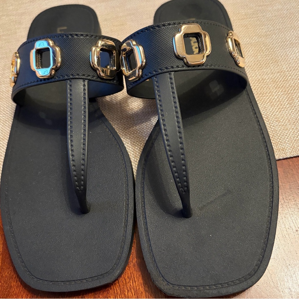 Larroude Black Thong Sandals with Gold Accents.